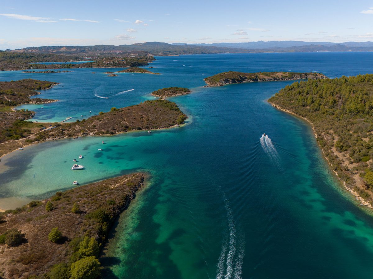 Turquoise Bliss: Drone photo of the kruftos Lagoon, Diaporos Island. kruftos Lagoon, Diaporos Island.