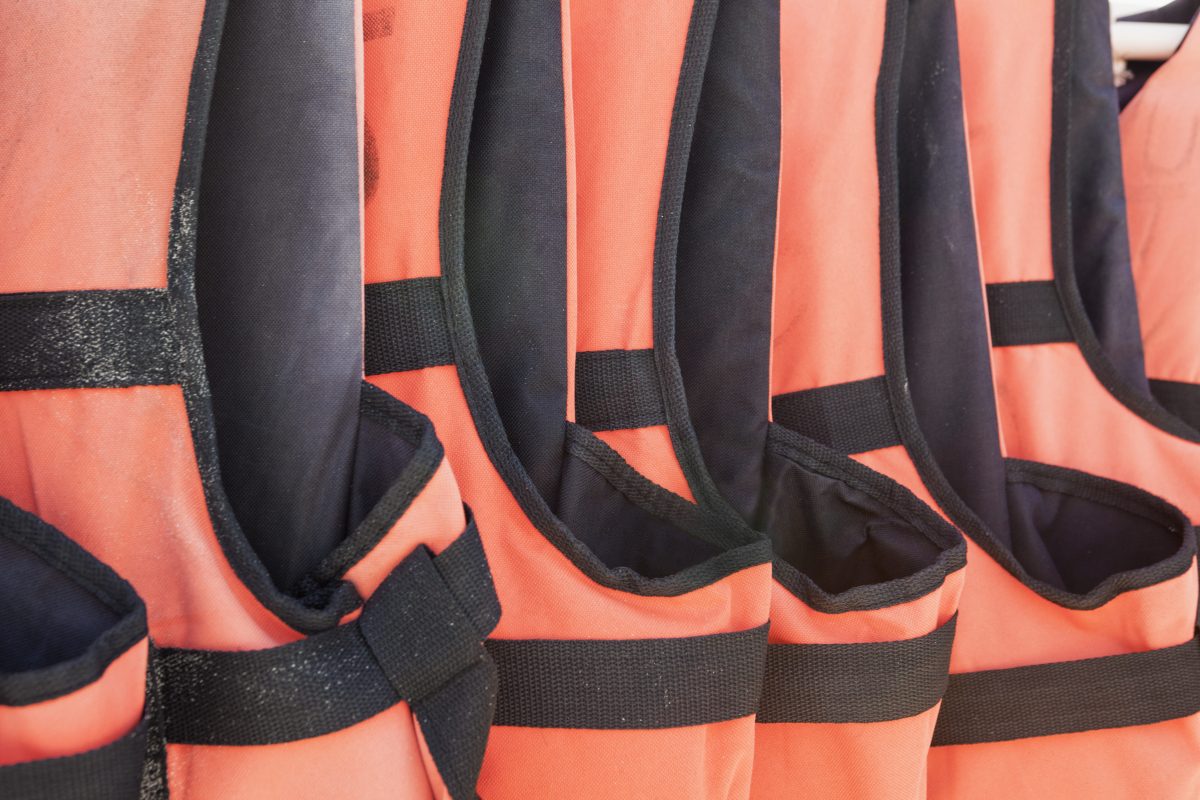 close-up-of-orange-life-jackets-in-a-row-2023-11-27-05-03-23-utc close-up-of-orange-life-jackets-in-a-row-2023-11-27-05-03-23-utc